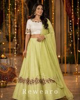 Pistachio Green Lehenga with Ivory Embroidered Choli & Sheer Dupatta