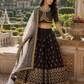 Midnight Noir Heritage Embroidered Lehenga Set with Ornate Gold Blouse and Sheer Dupatta