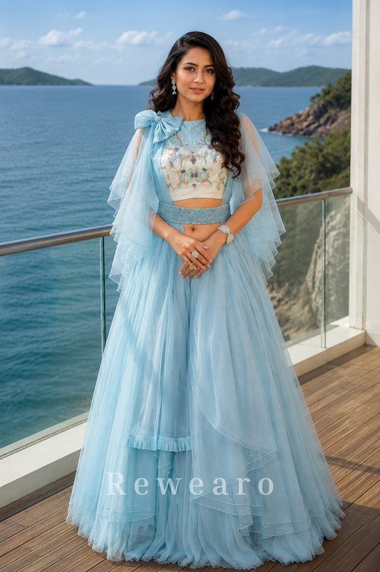 Powder Blue Layered Ruffle Lehenga Set with Printed Blouse and Dramatic Cape Sleeves