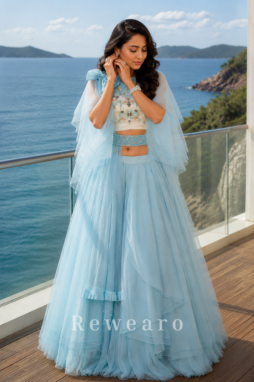 Powder Blue Layered Ruffle Lehenga Set with Printed Blouse and Dramatic Cape Sleeves