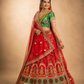 Crimson Bridal Lehenga with Folk-Figurative Border, Emerald Brocade Blouse & Ornate Veil