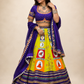 Vibrant Folk Art Patchwork Lehenga Set with Royal Blue Embroidered Blouse & Dupatta