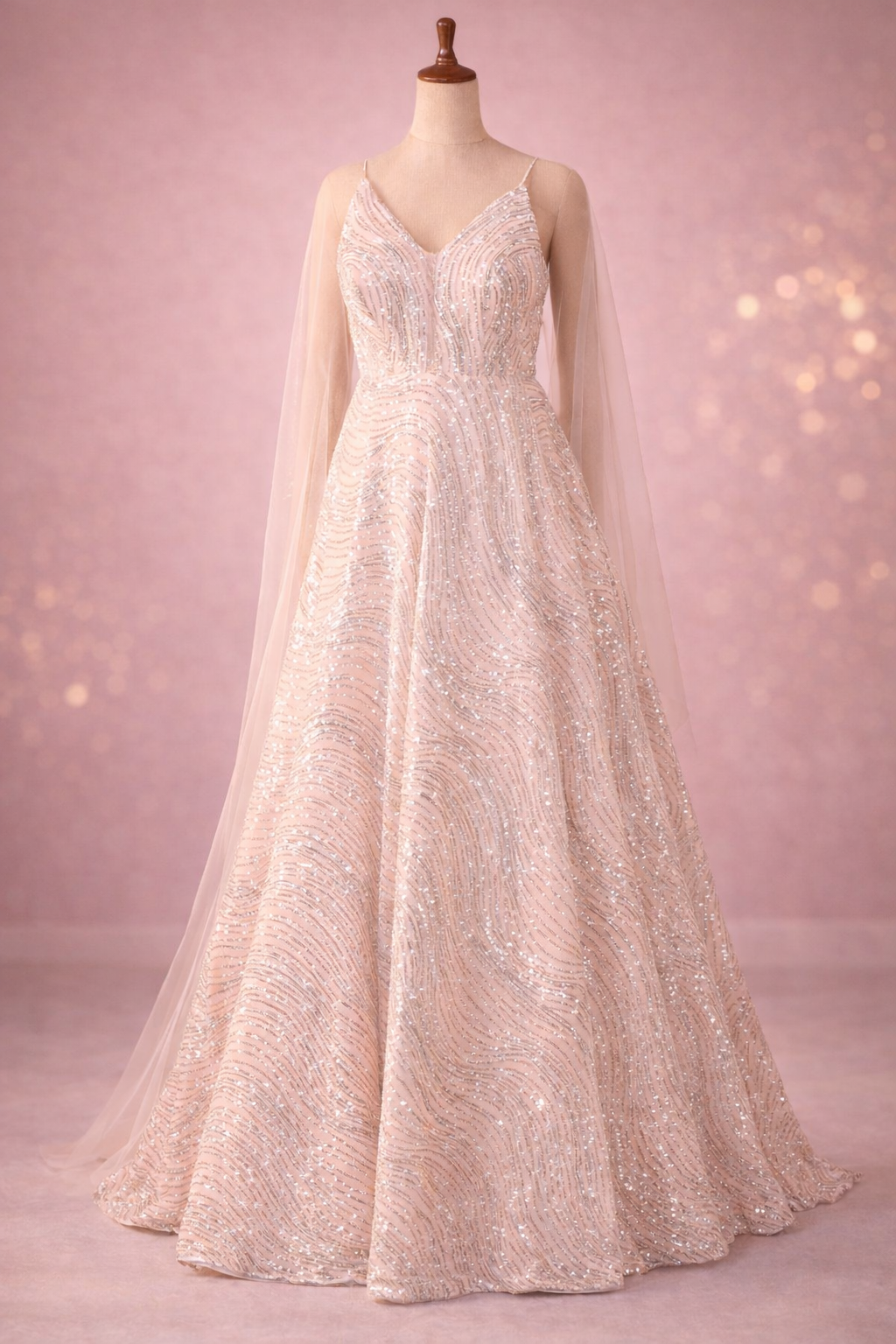 Blush Pink Sequined Evening Gown with Sheer Cape Sleeves